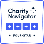 Charity Navigator four-star logo, square white logo with black text and small blue boxes with white stars