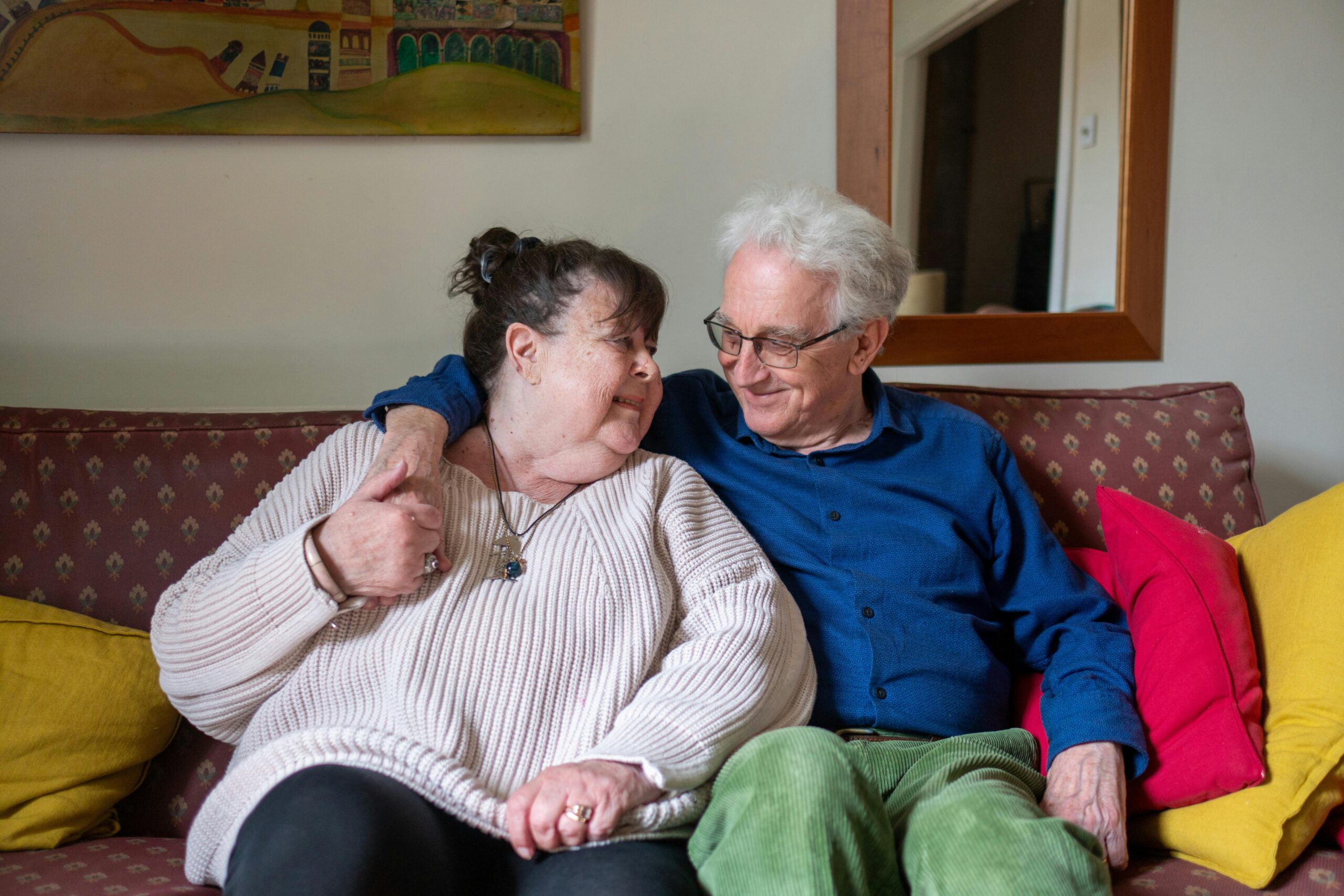 two older adults happy in their home